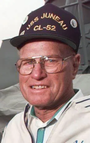 Elderly USS Juneau survivor Lester Zook wearing a USS Juneau CL-52 ball cap and glasses