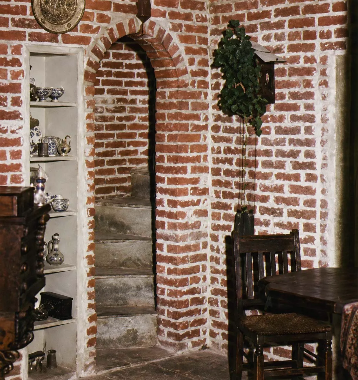 A circular staircase inside Corpsewood Manor.